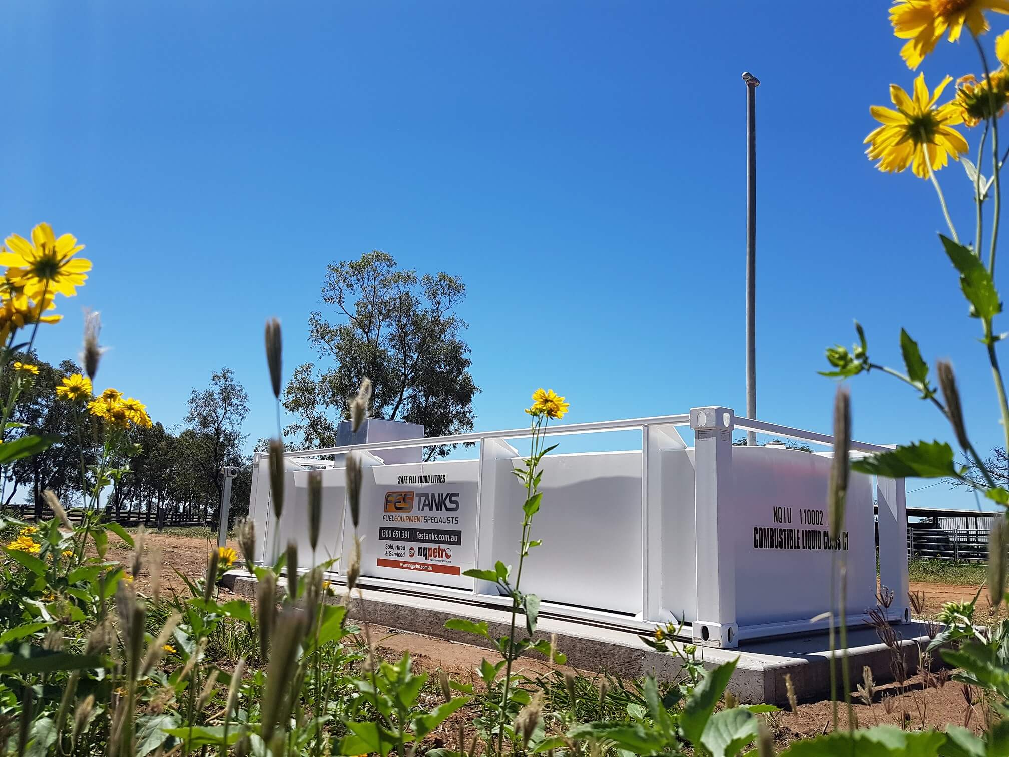 10000l self bunded tank on the farm, flowers, blue sky